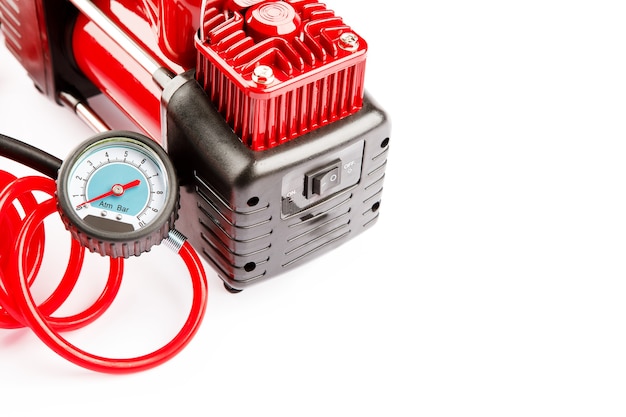 Car compressor isolated on white background. Electric pump inflates a car wheel