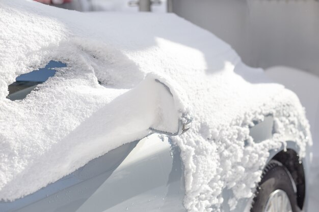 Car covered in snow.