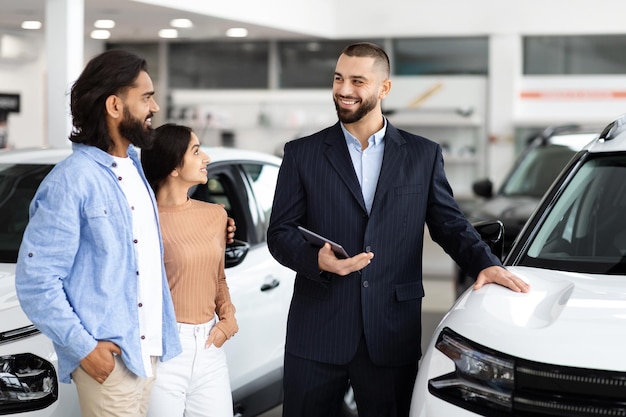 Car dealership interaction with salesman and customers