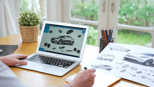 Car designer carefully analyzing car prototype synchronos