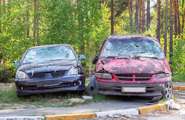 A car destroyed by shrapnel from a rocket that exploded nearby Irpensky automobile ce