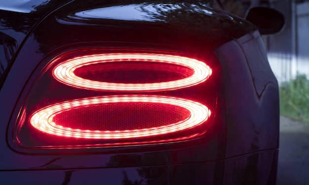 Car detail red car rear lights at night