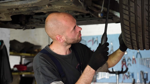 Car diagnostics an auto mechanic inspects a car auto repair shop breaking transmission