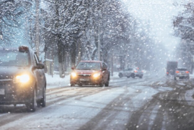 Car driving on snowy urban street