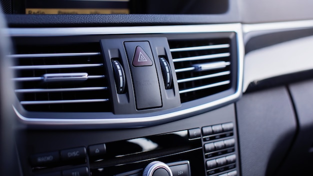 Car emergency lights button close up.