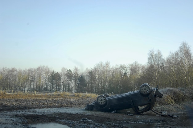 Car on field against clear sky