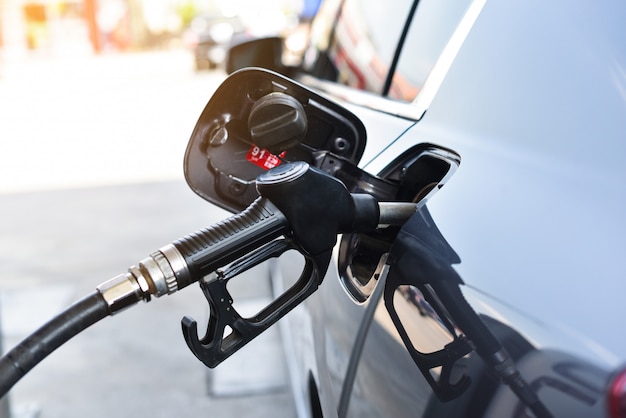 Car fueling petrol at station