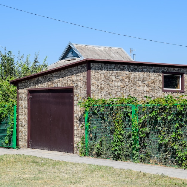 Car garage of corrugated metal profile