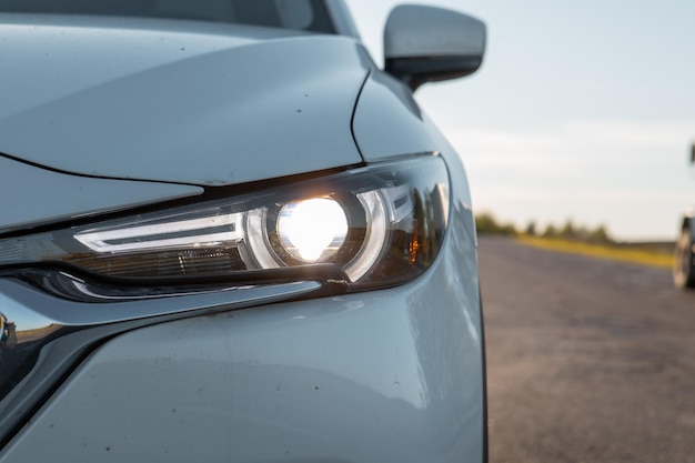 Car headlight close up road trip