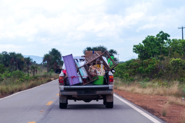 Car on the highway full of objects in the trunk