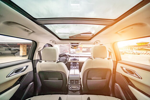 Car inside Interior of prestige modern car Comfortable leather seats Black cockpit with on isolated white background