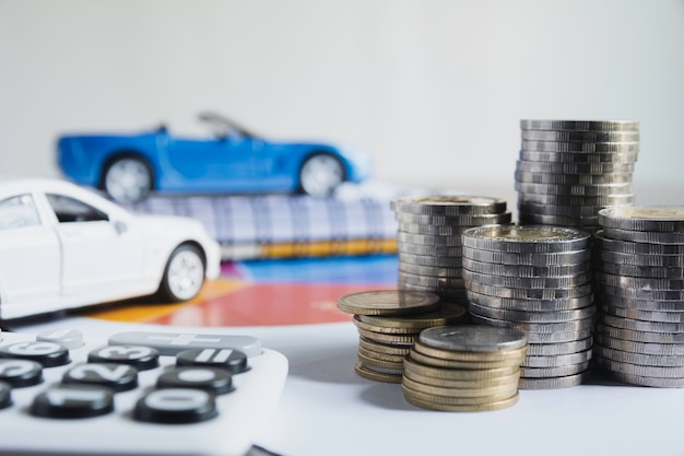 Car insurance and car service with stack of coins. 