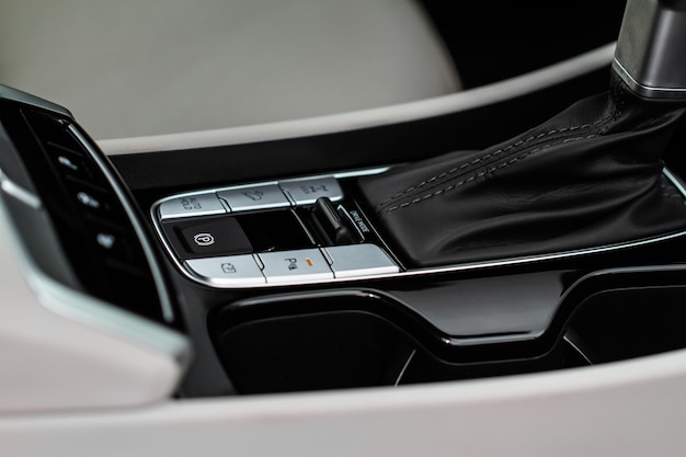 Car interior console close up view. gear stick with multimedia\
console.