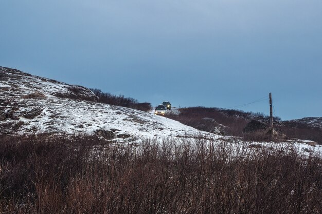 The car is on the move on a difficult icy road