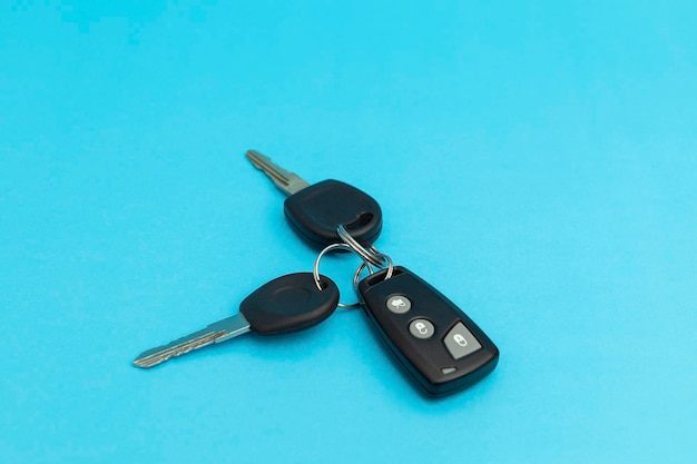 Car keys on blue background