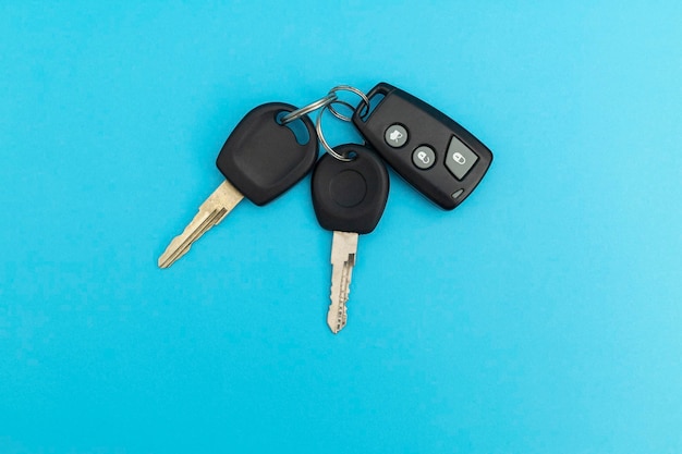 Car keys on blue background