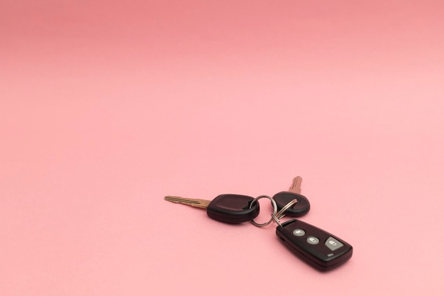 Premium Photo  Car keys on a pink background