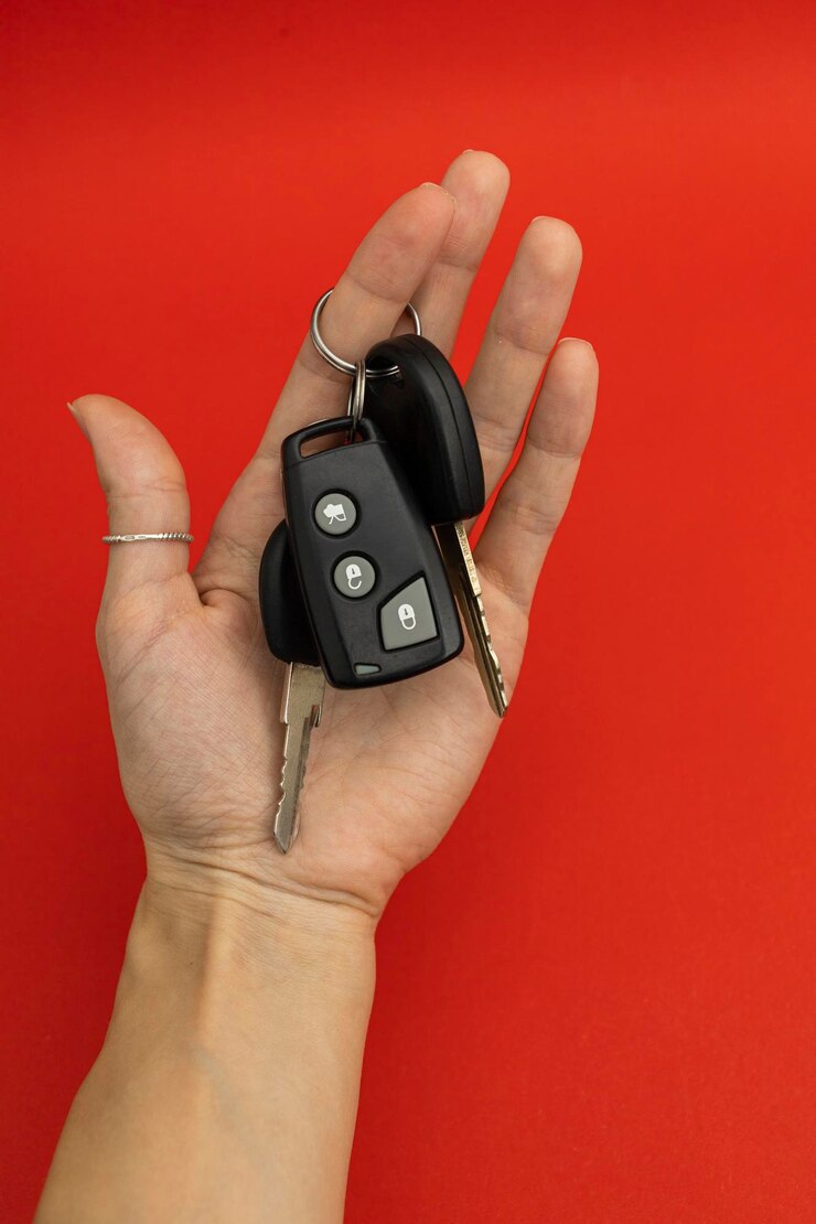 Car keys on red background