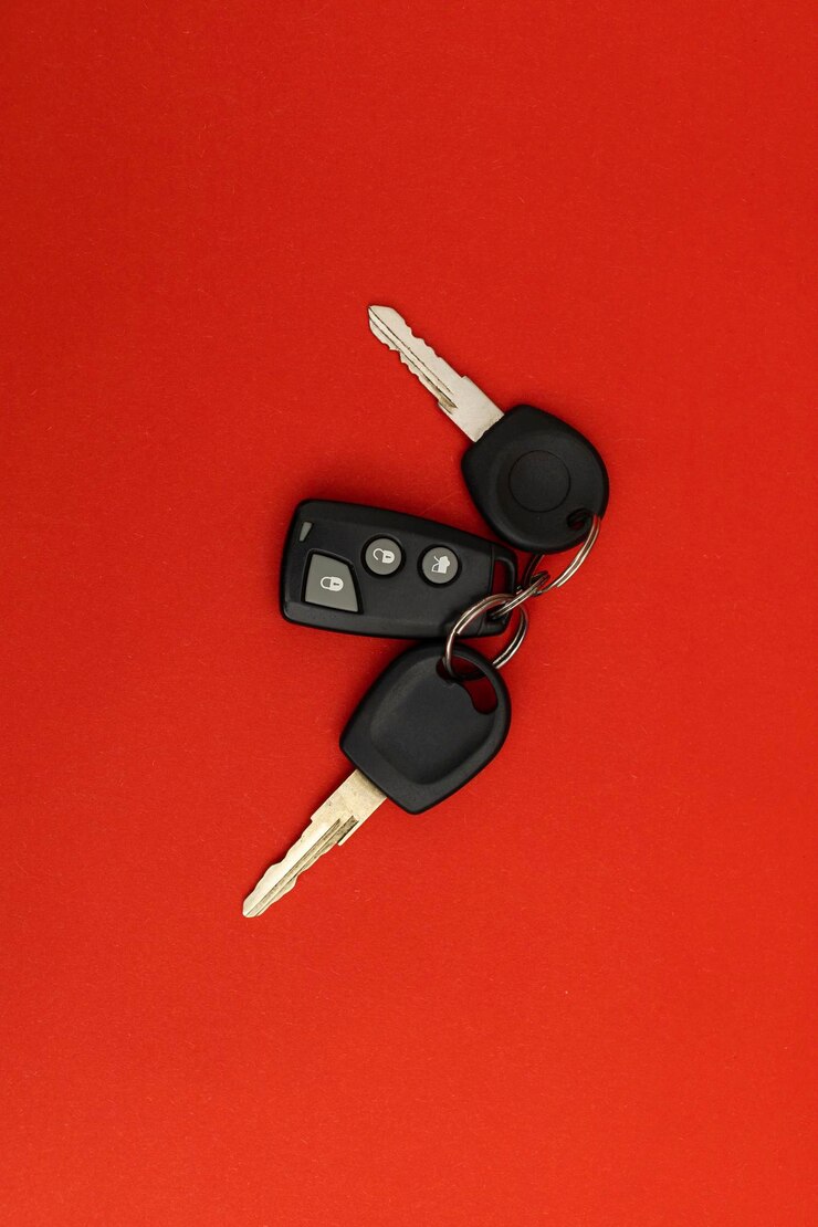 Car keys on red background
