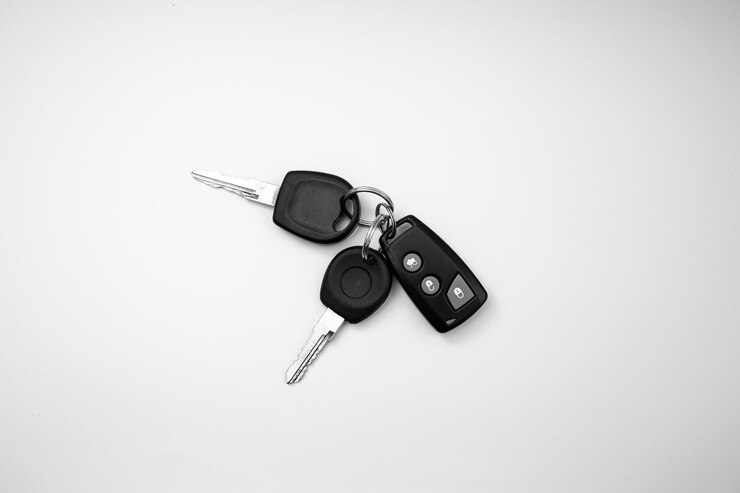 Car keys on white background