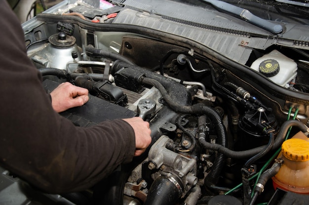 Car Mechanic car repair at one hundred diesel service diesel pump check car problems chip attack