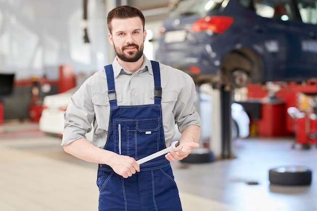 Car Mechanic Posing in Workshop