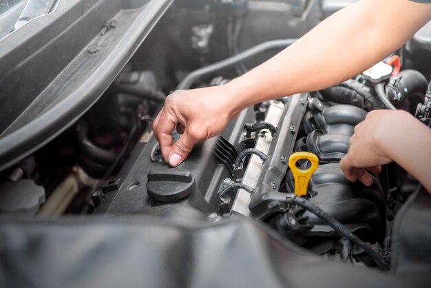 Car mechanic working on engine repair