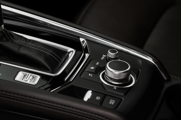 Car media controller close up Modern car media and navigation control buttons