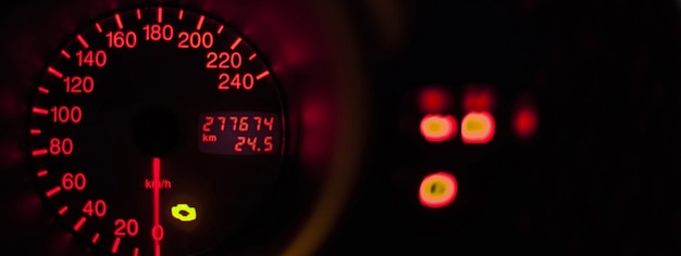 Photo car odometer illuminated, banner image with copy space