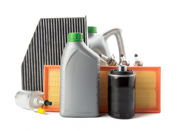 Car oil filters and motor oil can isolated on white