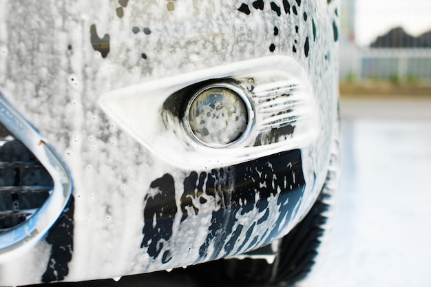 Car in outdoors selfservice car wash car in foam toned