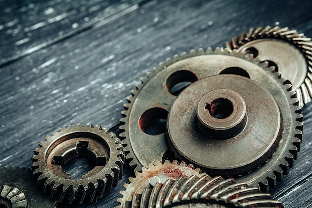 Car parts gears and bearings on wooden background