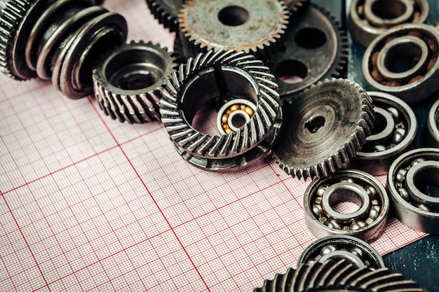 Car parts on graph paper close up. Engineering 