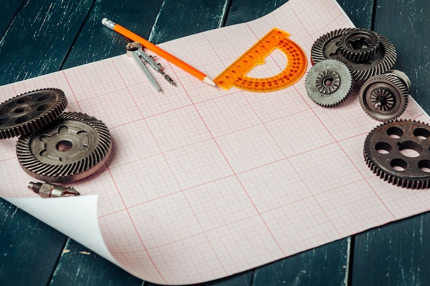 Car parts on graph paper close up. Engineering 