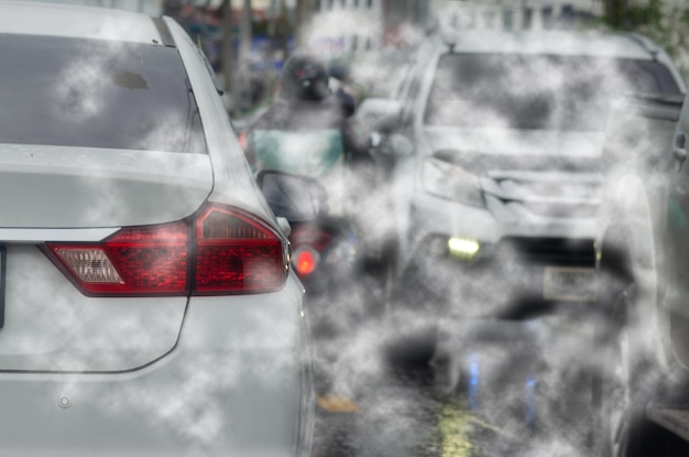 Photo car pollution smoke exhaust automobile pollution traffic jam on roadcar emitting carbon dioxide causing air pollution