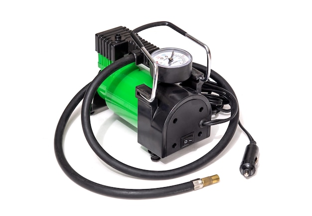 Car pump with manometer green air compressor on white background