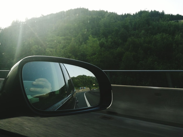 Photo car reflecting on side-view mirror