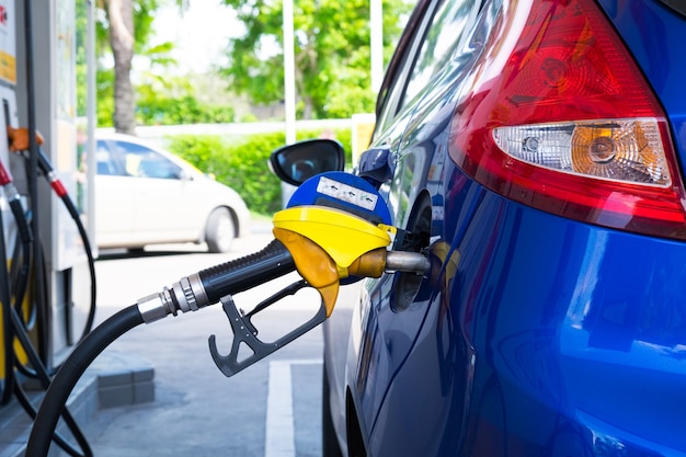 Car refueling on a petrol station closeup