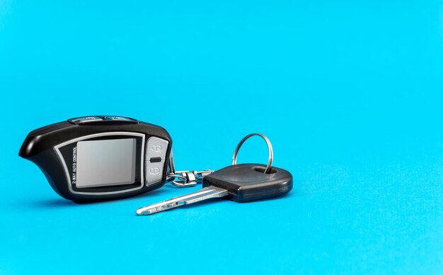 Car remote control with car key on a blue background