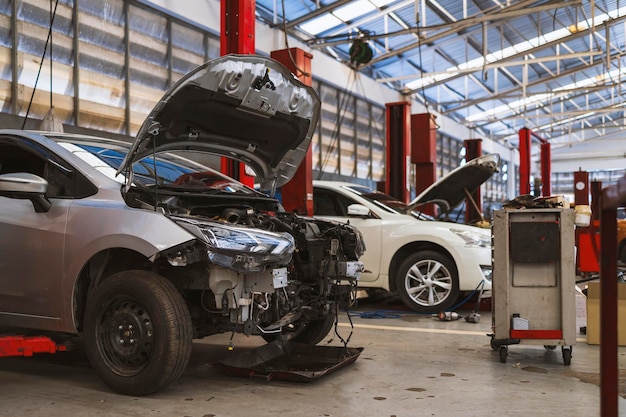car repair in garage service station with softfocus and over light in the background