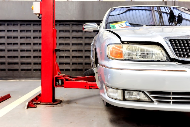 Car repair station with soft-focus in the background and over light