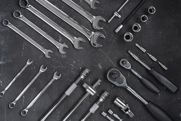 Car repair tools on a dark background. Neat wrench layout