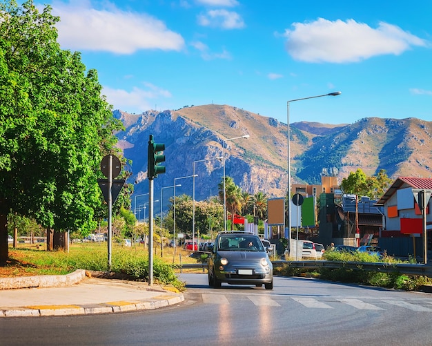 Car on road in Palermo, Sicily, Italy