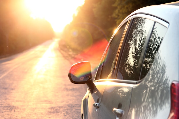 A car on the road with sunset