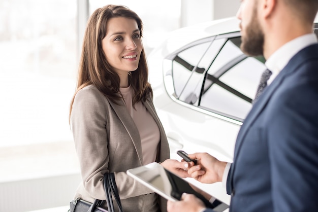 Car Salesman Working with Client