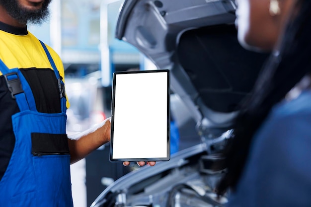 Car service worker holds mockup device