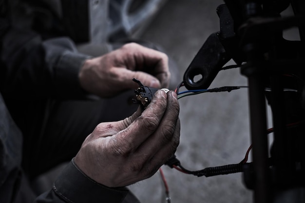 Car service worker repairs restores car