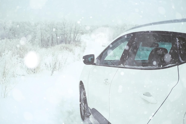 car in a snowy landscape nature white winter snow