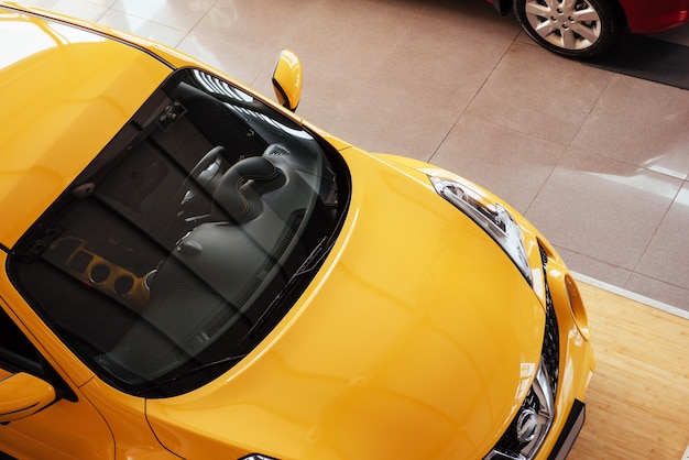 Photo of the car in the spacious showroom with large windows