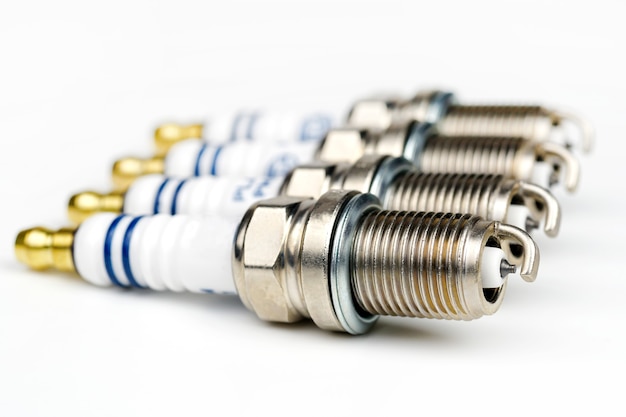 Car spark plug isolated on a white background Close up